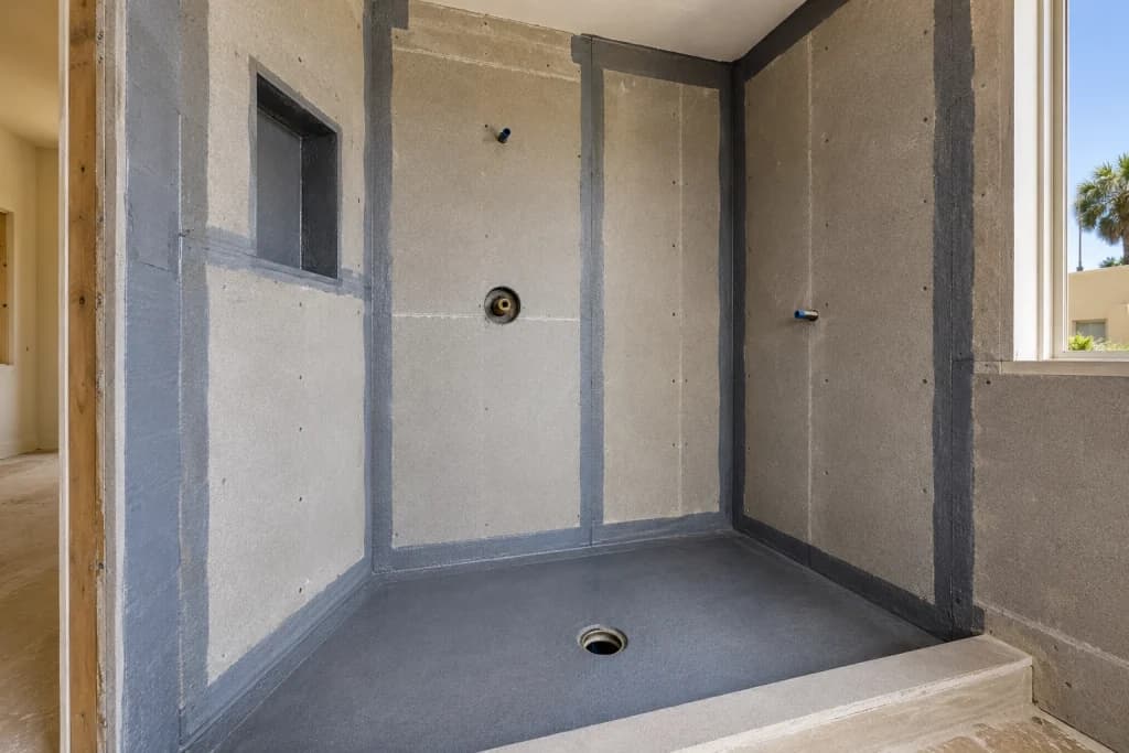 Shower waterproofing membrane and sealed wall assembly before tile installation